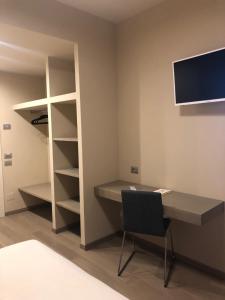 TV a/nebo společenská místnost v ubytování Albergo Tre Pozzi