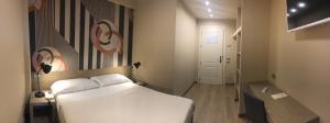 Postel nebo postele na pokoji v ubytování Albergo Tre Pozzi