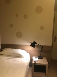 Postel nebo postele na pokoji v ubytování Albergo Tre Pozzi