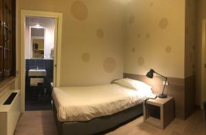 Postel nebo postele na pokoji v ubytování Albergo Tre Pozzi
