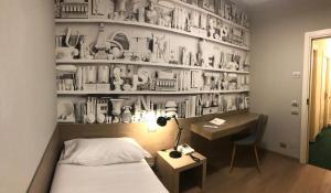 Postel nebo postele na pokoji v ubytování Albergo Tre Pozzi