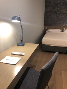Postel nebo postele na pokoji v ubytování Albergo Tre Pozzi