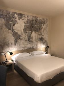 Postel nebo postele na pokoji v ubytování Albergo Tre Pozzi