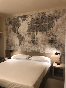 Postel nebo postele na pokoji v ubytování Albergo Tre Pozzi