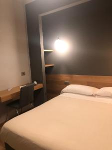 Postel nebo postele na pokoji v ubytování Albergo Tre Pozzi