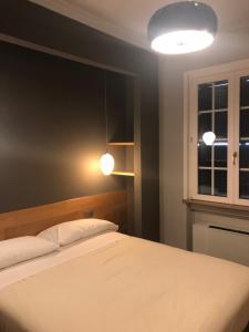 Postel nebo postele na pokoji v ubytování Albergo Tre Pozzi