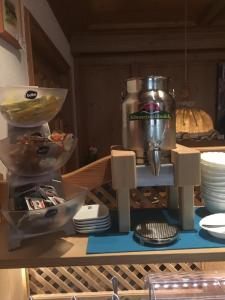 a kitchen counter with a mixer on a table at Gasthaus Schützen in Hornberg