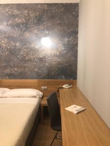 Postel nebo postele na pokoji v ubytování Albergo Tre Pozzi