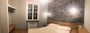 Postel nebo postele na pokoji v ubytování Albergo Tre Pozzi