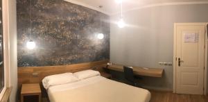 Postel nebo postele na pokoji v ubytování Albergo Tre Pozzi
