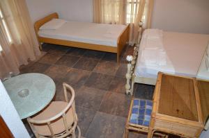 Postel nebo postele na pokoji v ubytování Hotel Rigakis