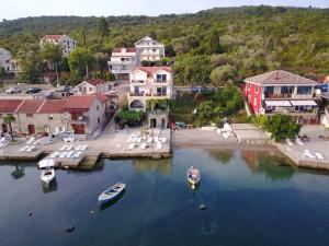 an aerial view of a town with boats in the water at Franovic Apartments in Tivat