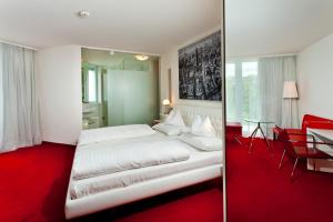 Posteľ alebo postele v izbe v ubytovaní Casinohotel Velden