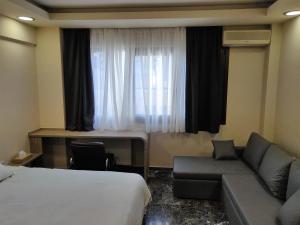 A bed or beds in a room at Agias Sofias Street Luxurious Studio
