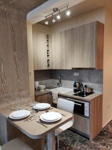 A kitchen or kitchenette at Agias Sofias Street Luxurious Studio