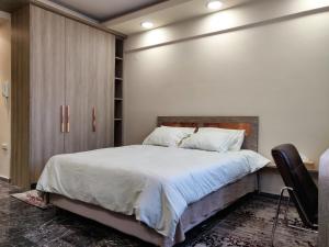 A bed or beds in a room at Agias Sofias Street Luxurious Studio