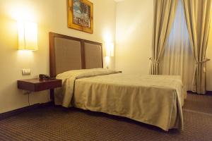 Postel nebo postele na pokoji v ubytování Hotel dei Gonzaga