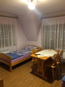 Posteľ alebo postele v izbe v ubytovaní Pokoje Gościnne Pod Gubałówką
