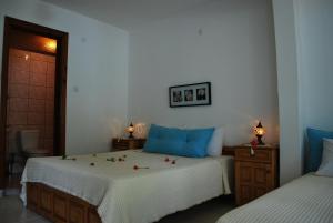 Postel nebo postele na pokoji v ubytování Myra Hotel
