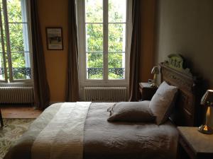 Säng eller sängar i ett rum på Château des Grandes Vignes