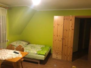 Posteľ alebo postele v izbe v ubytovaní Pokoje Gościnne Pod Gubałówką