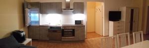 a kitchen with a sink and a stove top oven at Apartment nahe Rosenhügel in Vienna