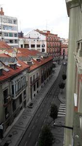 a view of a city street with buildings at EMILIA -Claudio Moyano in Valladolid