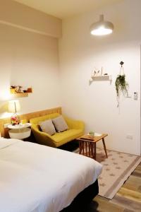 A bed or beds in a room at See U Tainan Apartment