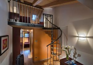 a staircase leading up to a room with a balcony at Annia Park Hotel Venice Airport in Tessera