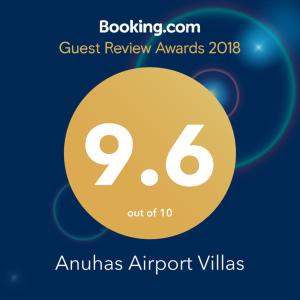 a sign that reads quest review awards with a yellow circle at Anuhas Airport Villas in Katunayaka