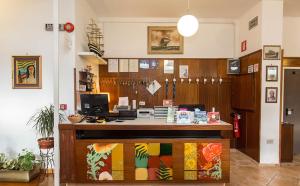 a office with a counter with a computer on it at Hotel Anna in Terracina