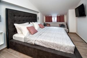 Postel nebo postele na pokoji v ubytování Apartments Miki 2