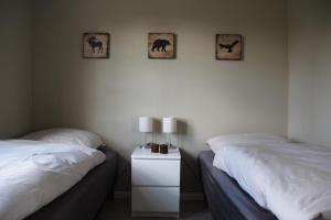 Ένα ή περισσότερα κρεβάτια σε δωμάτιο στο Das rote Haus hinterm Deich
