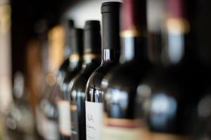 a bunch of bottles of wine are lined up at Hotel Boutique Casadoca in Concón