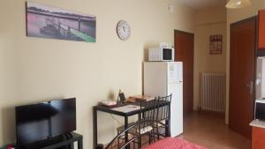 Televiisor ja/või meelelahutuskeskus majutusasutuses Cozy Loft