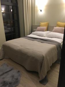 Posteľ alebo postele v izbe v ubytovaní Apartamenty Platinum Loft