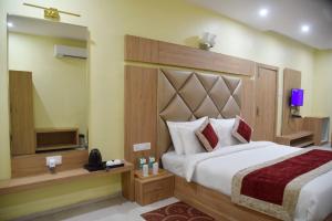 A bed or beds in a room at The River Front Resort
