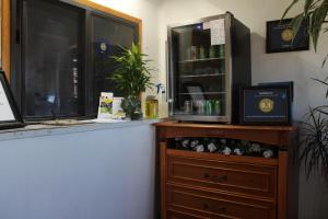 a room with a dresser and a window and a counter at Thunderbird Motel Las Vegas/ New Mexico in Las Vegas