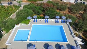 an overhead view of a swimming pool at a resort at Villas Michalis in Chorafakia