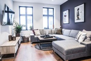 a living room with a couch and a table at Neumannsgate 4 in Bergen