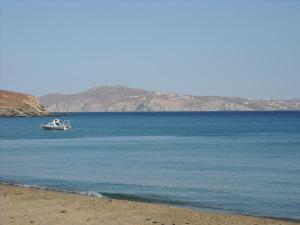 a boat in the middle of a large body of water at Irini Studios in Tinos in Agios Ioannis Tinos