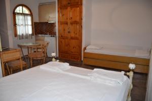 Postel nebo postele na pokoji v ubytování Hotel Rigakis