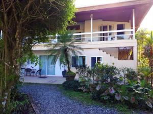 a view of a house from the garden at Playa Bluff Lodge in Bocas del Toro