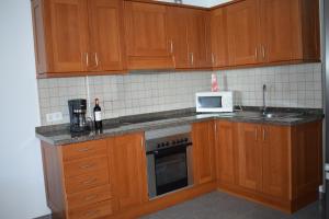 Kuchyňa alebo kuchynka v ubytovaní Residencial Islas + 16 fotografií