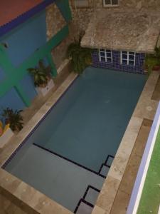 an overhead view of a swimming pool in a house at A1 Apartments Aruba in Oranjestad