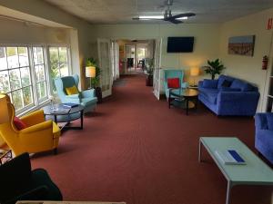 a living room filled with furniture and a large window at Clare Valley Motel in Clare