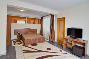 Postel nebo postele na pokoji v ubytování Hotel Tranzzit