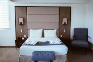 
A bed or beds in a room at Panja Resort Palawan
