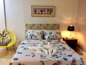 Postel nebo postele na pokoji v ubytování VL Garden Suites