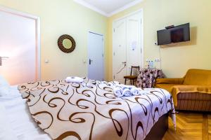 Postel nebo postele na pokoji v ubytování V Park Hotel